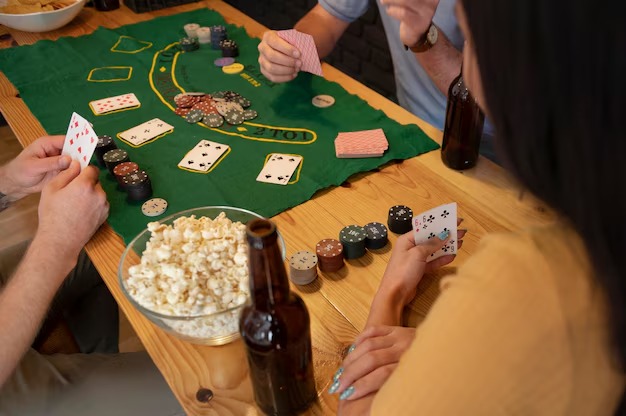 Live dealer dealing Three Card Poker cards